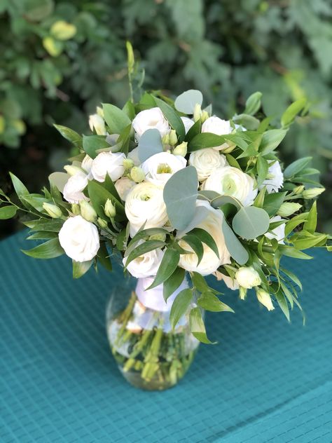 White garden roses, ranunculus, lisianthis with eucalyptus and ruscus greenery. Ruscus Greenery, Greenery Bridal Bouquet, White Garden Roses, Eucalyptus Bouquet, White Ranunculus, White Garden, White Gardens, Garden Roses, White Bouquet