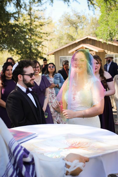 Rainbow veil from https://offbeatwed.com/dungeons-and-dragons-interfaith-wedding/ Rainbow Veil, Jewish Christian Wedding, Interfaith Relationship, Interfaith Wedding, Country Line Dancing, Offbeat Bride, Christian Wedding, Jewish Wedding, Reception Dress