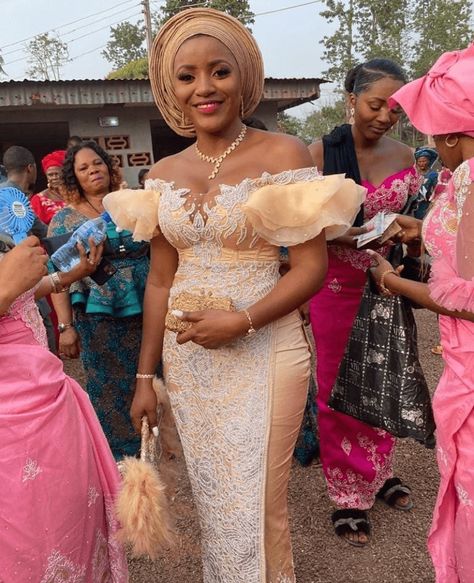 Igbo Bride In Beautiful Lace Off Shoulder Traditional Wedding Attire and Headtie | Clipkulture | Clipkulture Nigerian Wedding Dresses Traditional, Igbo Traditional Wedding, Nigerian Wedding Dress, Igbo Bride, African Wedding Attire, African Lace Styles, Traditional Wedding Attire, Lace Gown Styles, African Fashion Skirts