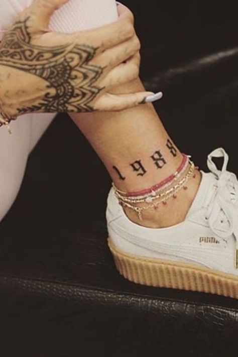 1988 tattoo on the ankle | www.otziapp.com Rihanna Tattoo, Simpsons Tattoo, Knuckle Tattoos, Latest Tattoos, Dainty Tattoos, Celebrity Tattoos, Ankle Tattoo, Dope Tattoos, Foot Tattoos