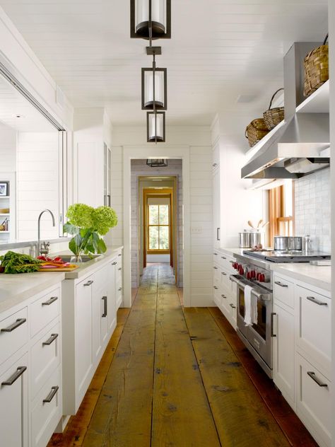 Designed for a fun young family, this Maury Island waterfront vacation home embodies the essence of tradition. The comfortable… Galley Kitchens Ideas, Galley Kitchen Cabinets, Small French Country Kitchen, White Galley Kitchens, Galley Kitchen Renovation, Galley Kitchen Remodel Ideas, Galley Kitchen Design, Kitchen Peninsula, Galley Kitchen Remodel