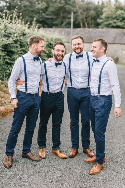 a stylish groom's outfit with navy pants and suspenders, light blue shirts, navy bow ties, brown shoes Smart Casual Groom, Usher Outfits, Navy Blue Groomsmen, Navy Blue Wedding Theme, Dress Code Outfits, Groomsmen Dress, Blue Groomsmen, Navy Groom, Wedding Groomsmen Attire