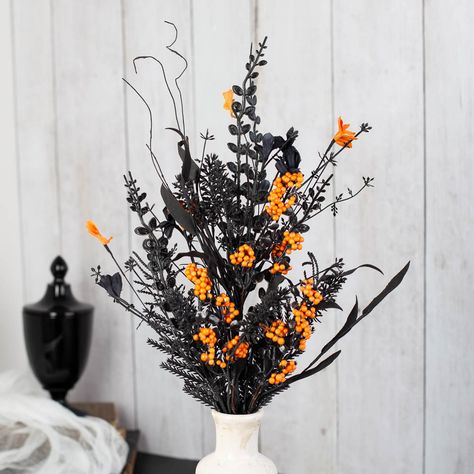 Berry Garlands for sale Halloween Black and Orange Floral and Berry Spray. The Halloween Floral and Berry Spray is the perfect addition to any spooky decor. This spray features a combination of orange and black flowers, along with orange berries. The flowers and berries are attached to a wire stem, making it easy to incorporate into a wreath or centerpiece. The colors and unique design are sure to add a touch of Halloween spirit to any decoration.    It will make a fun addition to your Halloween-inspired arts and craft projects. Place it in centerpiece, floral arrangement or add it to a spooky wreath. Halloween Floral Centerpieces, Spooky Flower Arrangements, Orange And Black Flowers, Halloween Arrangements, Halloween Flower Arrangements, Flower Diy Paper, Halloween Floral Arrangements, Paper Flower Diy, Spooky Wreath