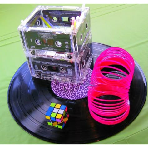 cassette tape centerpieces | 80's centerpiece's made from cassette tapes, record, slinky, and ... 80s Centerpieces Diy Table Decorations, Festa Rock Roll, 90s Party Ideas, 80's Prom, Decades Party, 80s Birthday, 80s Party Decorations, 80's Theme, 80s Wedding