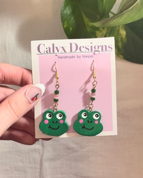 Handmade froggy earrings!! I made the charms from clay, painted them, and turned them into earrings. #froggy #frogs #froglover #frogcore #frogearrings #frogearring #frogjewelry #frogaccessory #frogstyle #frogcollection #frogcollector #cutefrog #froggie #froggy #froggystyle Froggy Earrings, Frog Jewelry, Fairytale Dress, Cute Frogs, Frogs, Charms, Turn Ons, Quick Saves, Design