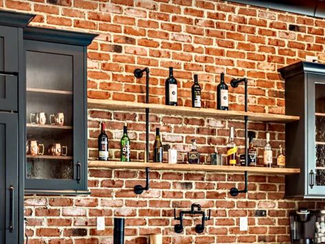 Brick Wall Bar Ideas, Wet Bar With Brick Backsplash, Bar With Brick Wall, Brick Wall Bar, Faux Brick Wall Basement Bar, Bar Shelves Brick Wall, Wall Bar Ideas, Rustic Basement Kitchenette, Brick Wall Whiskey