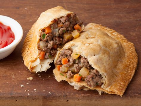 Michigan Pasty (Meat Hand Pie) You can't truly be from Michigan until you've enjoyed a real pasty :)) Meat Hand Pie Recipe, Pasties Recipes, Hand Pie Recipes, Hand Pie, State Foods, Meat Pie, Hand Pies, Cooking Channel, Beef Dishes