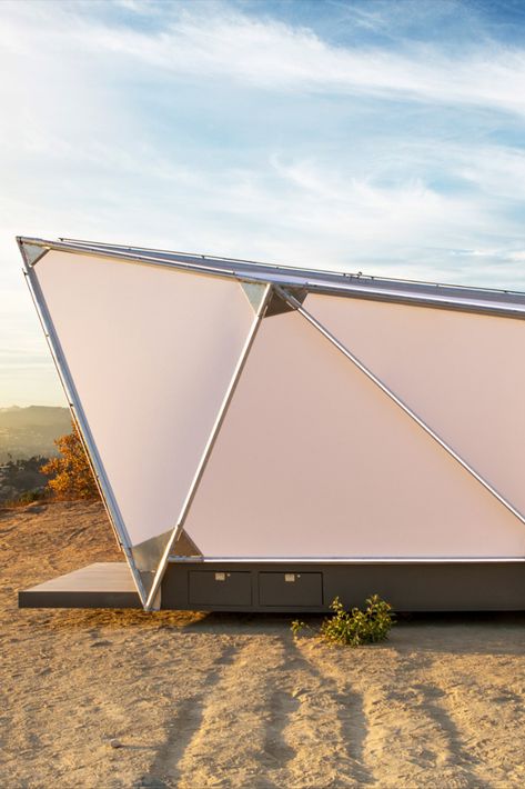 Space travel was the inspiration for this flat-pack cabin by prefab company Jupe, which offers a futuristic alternative to tents. The pod is a step up from the usual canvas teepee, supported by a set of illuminated LED rods that emphasise the Jupe’s sci-fi appearance after the sun sets. Photography: Sam Gezari. #prefab #grannypod #pod #tinyhome #architecture #property #design Micro Cabin, Canvas Teepee, Sleeping Pods, Glamping Tent, Capsule Hotel, Tent Set Up, A Space Odyssey, 2001 A Space Odyssey, Office Pods