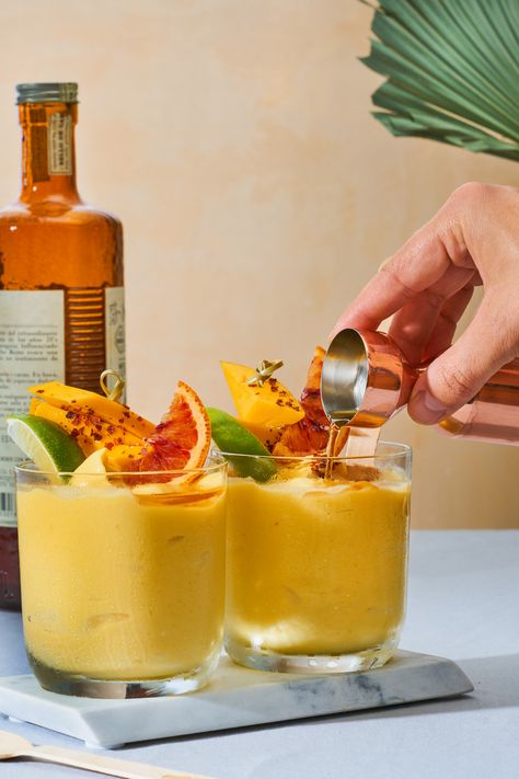 Beat the Heat with Boozy Mango-Chile Slushies - Front + Main Cheese Grazing Table, Mango Chile, Mango Rum, Slushie Recipe, Mango Lassi, Fancy Cocktails, Grazing Table, Spiced Rum, Most Popular Recipes