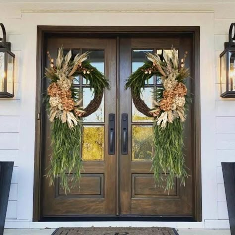 This beautiful neutral fall wreath will be the perfect touch for your door, double doors, columns, wall, etc. Wreath is made on a grapevine base and packed full of quality faux hydrangeas, pumpkins, pampas, greenery and fall florals. Shown in the 24" grapevine base. The blue door is 35" wide. Double door wreaths will be made mirrored. Smaller wreaths will have fewer florals to fit on wreaths.  14" base Dimensions: Wreath grapevine base 14" Height approx 28" Width approx 22" Depth approx 8" 18" base Dimensions: Wreath grapevine base 18" Height approx 34" Width approx 26" Depth approx 8" 24" base Dimensions: Wreath grapevine base 24" Height approx 40" Width approx 28" Depth approx 8" If you would like a custom size, color/flower, or have any questions, please message me! All items are packed Magnolia Wreath Front Door Fall, Wreaths For Fall Front Door, Fall Double Wreaths For Front Door, Country Grapevine Wreaths, Wreath For Double Front Door, Elegant Fall Wreaths For Front Door, Fall Porch Arrangements, Unusual Wreaths, Fall Door Swag