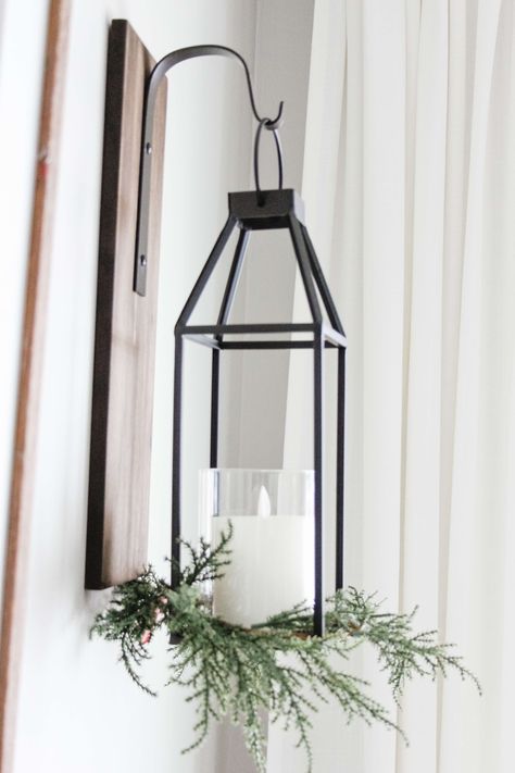 I love the way this target dollar spot candle wreath looks decorating this lantern from kirklands! This lantern is a beautiful wall sconce with that modern farmhouse style. Wall Lanterns Living Room, Candle Sconces Living Room, Large Candle Lanterns, Lantern With Candle, Hanging Wall Lanterns, Sconces Dining Room, Living Room Candles, Farmhouse Wall Sconces, Hanging Candle Lanterns