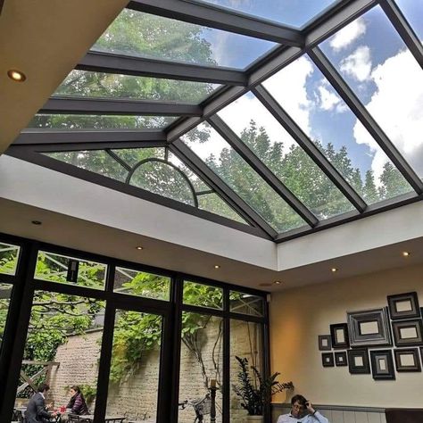 Roof Skylight Designs ✨️ #roof #skylight #rooftop #rooftoptentliving #homedesignsdworld #explorepost #explorepage Glass Atrium Architecture, Sky Roof Ceilings, Courtyard Glass Roof, Glass Roof Extension, Modern Skylights, Skylight Glass, Roof Skylight, Skylight Design, Folding Glass Doors