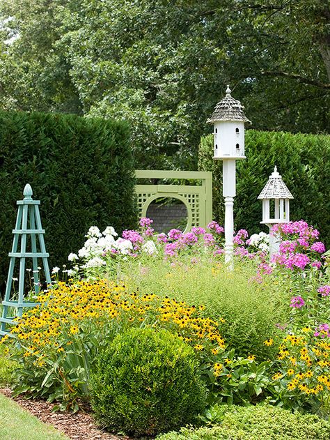 Even a small garden can become a haven for birds and butterflies when you choose flowers they prefer. For example, this square bed is packed with bird and butterfly favorites, such as black-eyed Susan and phlox. A bird feeder and birdhouse add to the garden's wildlife-friendly features. Small Flower Gardens, Birds And Butterflies, Small Patio Garden, Small Backyard Gardens, Garden Shrubs, Wildlife Gardening, Small Space Gardening, Flowers Wallpaper, Black Eyed Susan