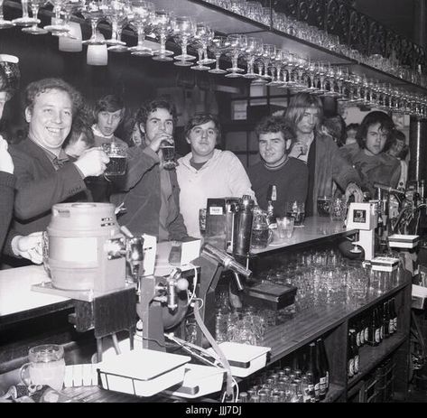 1970s, England, a group of male university or college sudents drinking beer at a bar, having fun during rag week. Stock Photo Thames Barrier, Modern Bikinis, Naïve Artist, Pool Halls, Bar Stock, Bath England, London Pubs, Tyne And Wear, Soho London