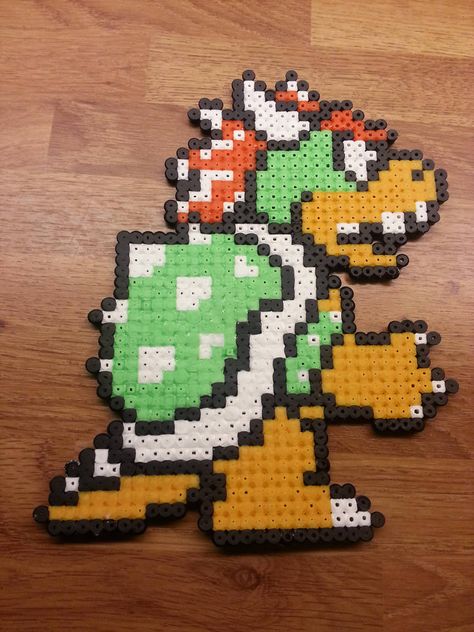 Bowser perler by TommyValkonen Bowser Perler, Hama Beads Mario, Perler Bead Mario, Modele Pixel Art, Fuse Bead Patterns, Perler Art, 8bit Art, Hama Beads Design, Fusion Beads