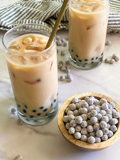 Boba tea, also known as bubble tea, is a hot topic these days and you've no doubt seen this fun-looking drink popping up on your Instagram or TikTok feed. So, what is it? It's a popular Taiwanese drink that originated in the '80s and consists of chewy tapioca pearls, tea, sweetener, and milk. #athome #boba #tea #bobatea Boba Tea Recipe, Black Tea Bags, Electric Tea Kettle, Tapioca Pearls, Flavored Syrup, Tea Recipe, Boba Tea, Coffee Creamer, Basic Recipes