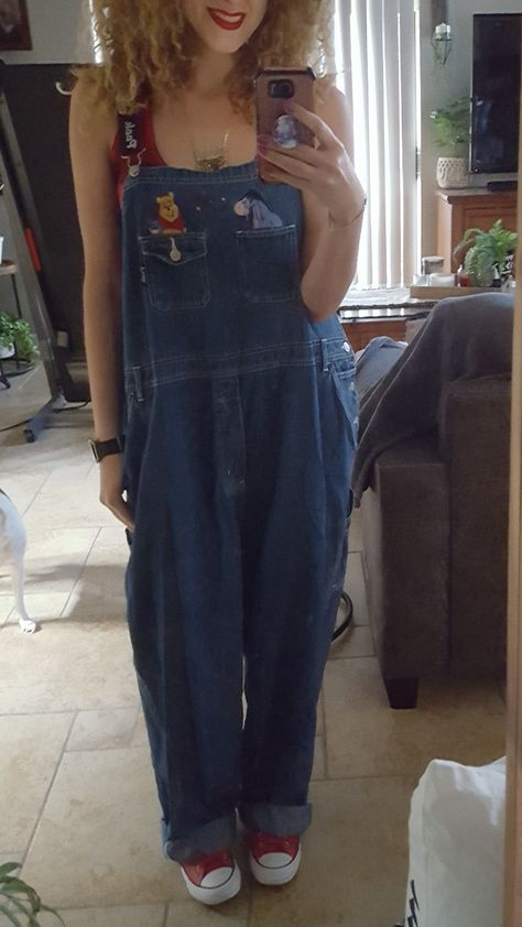 90s style grunge baggy loose-fitting Disney Winnie the Pooh overalls paired with a red and black plaid tank top shirt and some red Converse very retro Red Tank Top Outfit Aesthetic, Red Overalls Outfits, Grunge Overalls Outfits, 90s Aesthetic Overalls, Baggy Overalls Outfit 90s, Overalls Outfit Aesthetic Grunge, Overalls Outfit Grunge, Overalls Grunge, Red Plaid Shirt Outfit