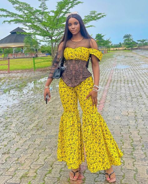 Ankara yellow corset top with palazzo trousera Two Piece Styles For Ladies, Ankara Corset Top, New Ankara Styles, Ankara Two Piece, Models Dresses, Ankara Corset, Yellow Ankara, Ankara Outfits, Ankara Jumpsuit