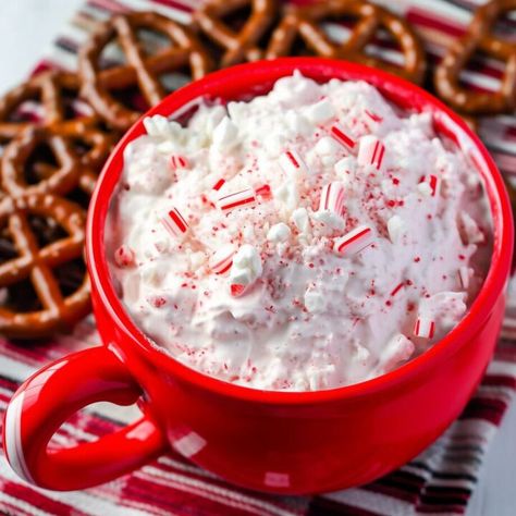 This mouthwatering peppermint cheesecake dip is perfect for dipping cookies, pretzels, fruit, or crackers! It's a quick and tasty treat that will bring even more joy to your festivities!During the holidays, I love indulging in festive foods, but I don't always have the time for complicated recipes. That's why I whipped up this Christmas cookie dough dip.It was a last-minute savior for my Christmas party. It's basically a richer, fluffier, creamier version of sugar cookie dough, topped… Christmas Sweet Dips For Parties, Christmas Dips For Parties Sweet, Sweet Christmas Dip Recipes, Christmas Funfetti Dip, Peppermint Dessert Dip, Christmas Cookie Dough Dip, Ham And Cheese Ball Recipe, Peppermint Cheesecake Dip, Christmas Cookie Dough