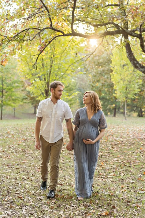 Soon-to-be parents hold hands during a Maternity Session as they gaze at each other and stroll through the park at sunset by Lily Sophia Photography near Atlanta, Georgia. #lilysophiaphotography Maternity Photography Park Ideas, Maternity Photos Park Picture Ideas, Maternity Photos At Park, Fall Park Maternity Photos, Maternity Pictures Park, Maternity Pictures At Park, Maternity Shoot Park, Maternity Shoot Park Photo Ideas, Park Maternity Pictures