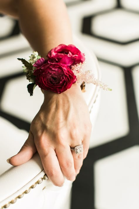 Family Corsages: A cluster of burgundy ranunculus accented with blush astilbe and the greenery of parvifolia eucalyptus on a pearl wristlet Corsages....STEMS | Pearl Events | The Belmont | Mint Photography Burgundy And Blush Corsage, Jewel Tone Wrist Corsage, Modern Wrist Corsage Wedding, Modern Wrist Corsage, Tapas Wedding, Blush Astilbe, Ranunculus Corsage, Parvifolia Eucalyptus, Formal Corsage