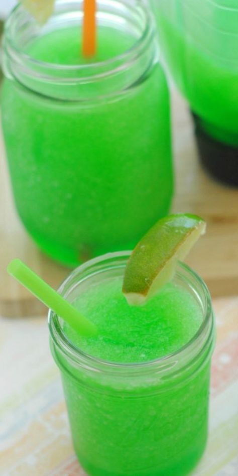 This recipe always reminds me of riding my bike to the Circle K when I was a kid, I was always after a yummy lime slushie! Now you can make this wonderful refreshing drink at home with Kool-Aid and the whole family will love this lime beverage, especially on those hot summer days! Green Slushie, Lemon Slush, Slushy Drinks, Green Punch, Lemonade Stands, Slush Recipes, Frozen Drink Recipes, Drink Recipies, Dinner Theater