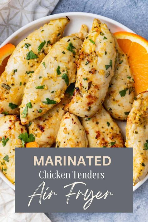 Marinated chicken tenders in an air fryer sprinkled with fresh herbs. Mediterranean Chicken Tenders, Air Fryer Chicken Tenderloins, Marinated Chicken Tenders, Chicken Tenders In Air Fryer, Emeril Air Fryer, Recipes Airfryer, Best Chicken Tenders, Air Fried Chicken Tenders, Healthy Chicken Marinade