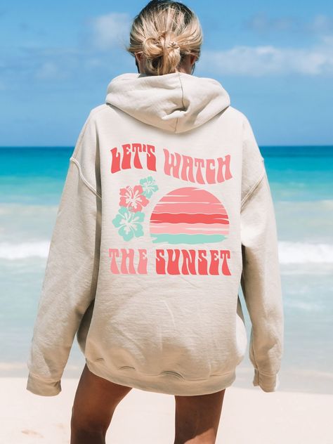 Get obsessed with the Coconut Girl Aesthetic with this cute Let's Watch The Sunset Hoodie! This Beachy Hoodie is super comfy! Size up for a Trendy Oversized Look! ♥ Hello and Welcome to Meaningful Tees Shop! ♥ Printed on the most popular Unisex Hoodie, the Gildan 18500 is 50% Cotton / 50% Poly. The soft fleece lining makes it super Comfy and is sure to become your new favorite! ♥ All of our items are made to order with care for each customer : ) ♥ Please allow 3-7 BUSINESS days (usually 3-5) for Coconut Girl Clothes, Sunset Sweatshirt, Forever Chasing Sunsets, Sunset Hoodie, Summer Hoodie, Surf Hoodie, Chasing Sunsets, Watch The Sunset, Sunset Summer