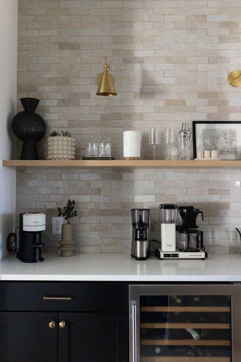 One of my favorite little nooks in our new house is our Butler’s Pantry! I love that this space is both functional and aesthetically pleasing! We continued the tile from the wall in our kitchen and it look so cohesive. We used a natural wood open shelving unit, giving us plenty of storage and countertop space. We also added a wine cooler — perfect for entertaining guests or just enjoying a glass after a long day at work! Tap to see all the details of this space and my coffee bar must haves! Bar With Floating Shelves, Small Wet Bar, Bar Renovation, Bar Nook, Butler’s Pantry, Home Bar Design, Coffee Bars In Kitchen, Coffee Nook, Home Coffee Bar