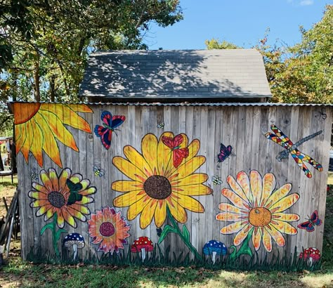 Flower Fence Painting, Flowers Painted On Fences, Shed Painting Ideas Flowers, Outdoor Wall Art Ideas Creative, Fence Painting Ideas Diy Projects, Outdoor Fence Mural Ideas, Fence Mural Ideas Backyards Diy, Garden Mural Outdoor Wall Art Easy, Wood Fence Painting Ideas