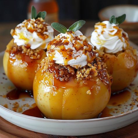 🍎🍰 Indulge in Cheesecake Stuffed Baked Apples! Warm, sweet, and irresistibly delicious. #BakedApples #DessertGoals Cheesecake Stuffed Baked Apples Recipe 🌟 Ingredients: 6 apples, cored 250g cream cheese, softened 50g sugar 5g cinnamon 5ml vanilla extract 1 egg 100g graham cracker crumbs 30g butter, melted Caramel sauce and whipped cream (for topping) Instructions: Preheat oven to 180°C (350°F). In a bowl, beat together cream cheese, sugar, cinnamon, vanilla extract, and egg until smooth. ... Stuffed Apples Baked, Cheesecake Stuffed Baked Apples, Baked Stuffed Apples, Easy Party Food, Beautiful Desserts, Trending Recipes, Baked Apples, Holiday Cooking, Treat Recipe