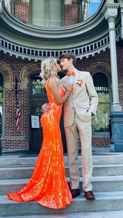 Orange Hoco Dress With Date, Blue And Orange Prom Couple, Orange Hoco Couple Outfits, Tux To Match Orange Prom Dress, Prom Dress And Tux Ideas, Prom Outfit Ideas For Couples, Orange Dress Prom Couple, Prom Color Themes Couples, Cute Prom Colors For Couples