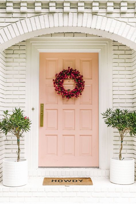 Soft and sweet, this light, blush pink door color makes a subtle statement against white, light gray, or beige siding or brick.  Click through to get the paint color and other colorful door decor ideas!  #doorcolor #frontdoorcolor #colorfuldoors #doorpaintcolor #frontdoorpaintcolor #doordecor #frontdoordecor Exterior Landscaping, Pink Front Door, Fine Paints Of Europe, Dark Paint Colors, Front Door Paint Colors, Door Colors, Door Paint Colors, Pink Door, Painted Front Doors