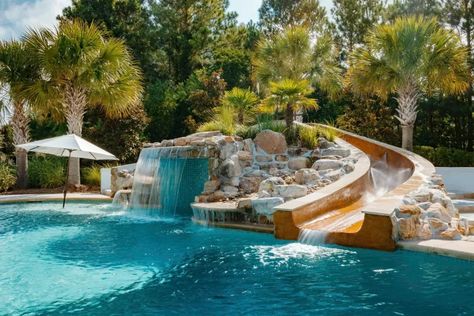 Sliding Rock Lagoon Custom Pool in Wilmington, NC Modern Pool With Waterfall, Pool With Stone, Pool With Grotto And Slide, Pool Grotto, Rock Pool Slide, Rock Slide Pool, Backyard Pool With Slide, Pool Slides Inground, In Ground Pools Backyard Ideas