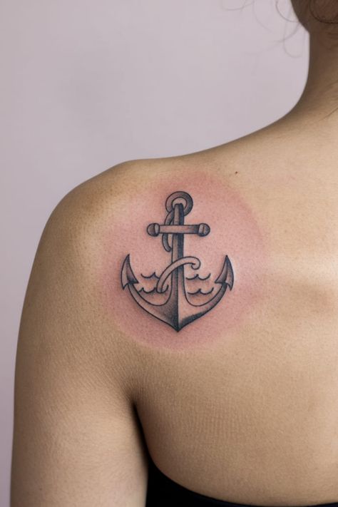 A small anchor with waves tattoo offers a subtle nod to the ocean and stability. This dainty shoulder tattoo is perfect for sea lovers and those who find strength in grounding. It�s cute, simple, and represents a strong foundation in life. Dainty Shoulder Tattoo, Anchor Tattoos For Women, Whale Tail Tattoo, Olive Branch Tattoo, Compass Rose Tattoo, Small Anchor, Airplane Tattoos, Hello Kitty Tattoos, Anchor Tattoos