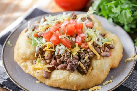 Delicious Homemade Fry Bread - aka "Navajo Tacos" or "Indian Bread" - one of the best recipes you'll ever try! Pillows of dough fried until it's a little crispy on the outside, but soft on the inside. Make it sweet or savory! Indian Fry Bread Recipe Easy, Indian Taco Recipes, Fry Bread Recipe, Indian Fry Bread, Navajo Tacos, Indian Tacos, Fried Bread Recipe, Bread Recipe Video, Homemade Fries