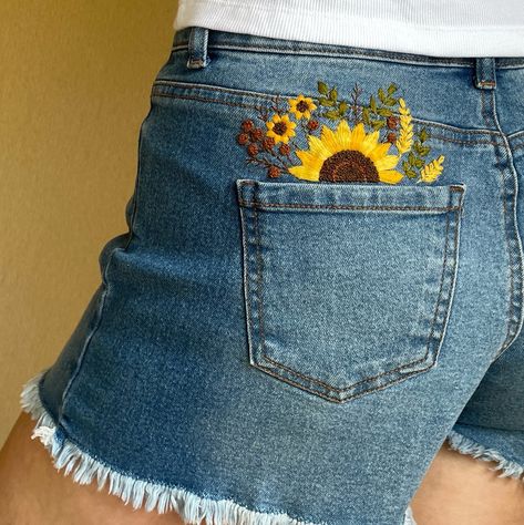 Sunflower embroidery pattern for shorts or jeans pockets is great for hand-embroidered summer denim clothing to make your clothes unique. Upgrade your look with this cute and versatile sunflowers pocket design! This listing is for a digital file only.  No physical item will be sent to you. This pattern for a patch back pocket of shorts is intended for those who already have a basic understanding of embroidery stitches and techniques.  It is suitable for anyone new to embroidery because it includes a step-by-step tutorial with a lot of photos! All the stitches used here are beginner-friendly! Your purchase includes: - A printable pattern.  This pattern is sized 6 x 13 cm (fits in a pocket of jeans, shorts, cap or T-shirt), but can be scaled up or down to fit any size;  - A color guide with Embroidery Designs For Pockets, Embroidery Back Of Jacket, Flower Jean Embroidery, Jean Shorts With Embroidery, How To Style Jean Shorts Summer, Embroidery On Clothes Tutorial, Jean Pocket Embroidery, Denim Embroidery Jeans, Jeans Embroidery Ideas