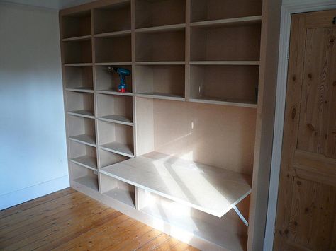 shelves with fold out desk 1 by Peter Murphy Carpentry, via Flickr Built In With Fold Out Desk, Half Bookshelf, Fold Down Desk With Storage, Diy Bookshelf Desk Combo, Bookshelves With Hidden Desk, Bookshelf With Fold Out Desk, Shelves With Fold Down Desk, Bookcase With Fold Down Desk, Bookshelf With Pull Out Desk