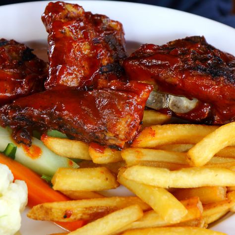 Ribs and chips by Kevin Richardson - Purchase prints & digital downloads. A plate full of Spicy ribs and chips along with some broccoli and cauliflower Ribs And Chips, Jack Daniels Ribs Recipe, Quincy Jones Ribs, Pineapple Spare Ribs Recipe, Spicy Ribs, Bbq Ribs Photography, Broccoli And Cauliflower, Kevin Richardson, Savory Food