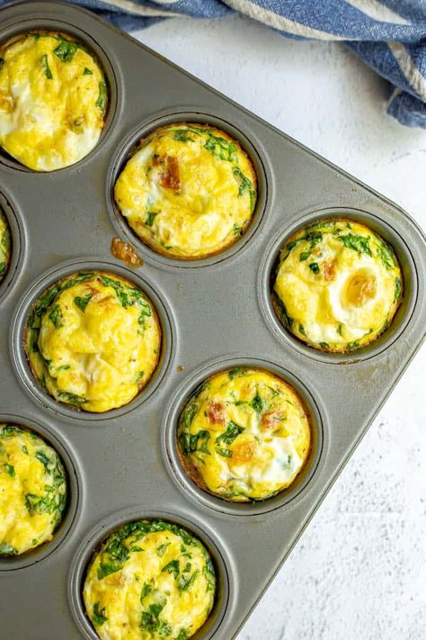 Breakfast egg muffins are loaded with bacon, spinach and cheese and baked in the oven for a delicious warm breakfast that’s perfect for brunch or for meal prep. They freeze and reheat great and you can customize the add-ins! #eggmuffins #breakfast #mealprep #breakfastideas #eggs Basic Deviled Eggs Recipe, Easy Egg Muffins, Breakfast Egg Muffins, Spinach Muffins, Egg Muffins Recipe, Greek Yogurt Flavors, Healthy Blueberry Muffins, Egg Muffins Breakfast, Food On The Table