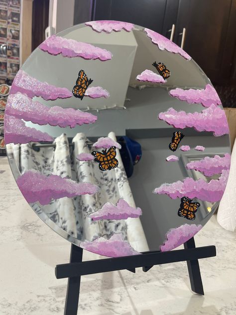 Beautiful hand painted Butterflies in Clouds of all different colors! 14x14 Round Mirror. Perfect for selfies for Instagram or Tik tok! All mirrors are sealed with Mod Podge so will not smudge when cleaned! Preferably clean with Windex gently! Made with Love Mirror Painting Ideas, Spiegel Diy, Painted Mirror Art, Painted Butterflies, Hand Painted Mirrors, Cloud Mirror, Butterfly Mirror, Easy Room Decor, Diy Wall Art Decor