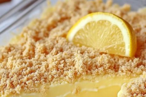 Make these frozen lemon dessert bars with a zesty lemon filling & buttery crust. Perfect summer treat that’s easy to make & delicious Frozen Lemon Dessert, Lemon Desserts Bars, Lemon Dessert, Frozen Lemon, Dessert Bar Recipe, Lemon Filling, Lemon Desserts, Graham Cracker Crumbs, Summer Treats