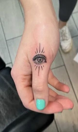 Eye Tattoo On Palm Of Hand, Eye Finger Tattoos For Women, All Seeing Eye Finger Tattoo, Eye On Finger Tattoo, Finger Eye Tattoo, Evil Eye Finger Tattoos For Women, Eye Tattoo On Finger, Evil Eye Finger Tattoo, Eye Finger Tattoo