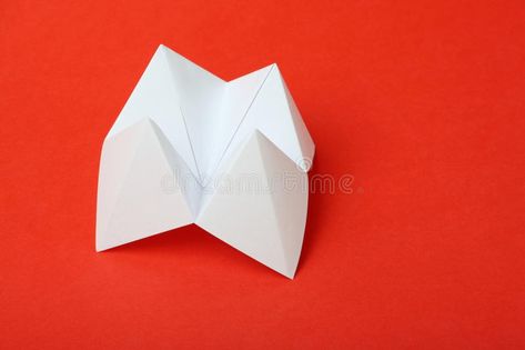 Origami Fortune Teller. An origami fortune teller or cootie catcher made from bl #Sponsored , #ad, #SPONSORED, #Teller, #Origami, #catcher, #origami Origami Fortune Teller, Fortune Teller Paper, Cootie Catcher, Fortune Teller, Blank White, Text Image, Presentation Design, Red Background, White Paper