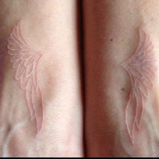 White ink angel wings tattoo. If I will ever get a tattoo, it will be similar to this one Tattoos White Ink, White Ink Tattoos, Fairy Wing Tattoos, White Tattoos, Cross Tattoos, White Ink Tattoo, Angel Wings Tattoo, Wing Tattoo, Bff Tattoos