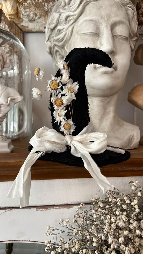 I made this hat to sit on a table, a pumpkin, a stack of books, etc....  Each one will be slightly different as they are handmade by me 🖤 I used black linen and then sewed black lace on top of it. the dried daisies are very fragile. please handle with care.  there will be natural shedding of the flowers during shipping.  when you store it please store it well in a box and bubble wrap cushioning the flowers so they don't break. then it'll look lovely again the following year etc.  No other accessories included Witch Hat Decorating Ideas, Dried Daisies, Halloween Decor Witch, Bibbidi Bobbidi Boo, Witch Hat Halloween, Columbia Tn, Decorating Crafts, Witch Party, Hay Barn