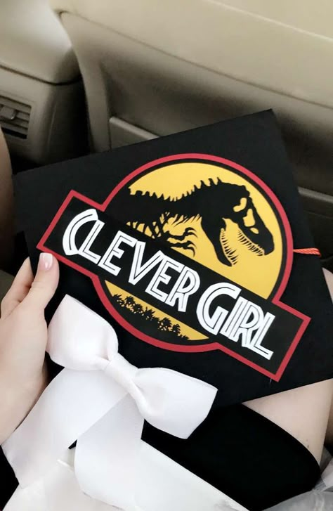 Jurassic Park Graduation Cap Jurassic Park Graduation Cap, Dinosaur Graduation Party, South Park Graduation Cap, Dinosaur Graduation Cap, Funny Grad Cap Ideas, Jurassic Park Theme, Diy Grad Cap, Funny Graduation Caps, Creative Graduation Caps