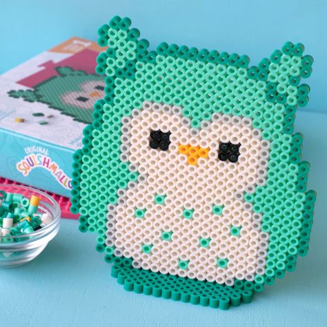 Buy the Perler™ Squishmallows™ Winston Fused Bead Kit at Michaels. Create Winston, the aspiring chef from the Squish Squad, with this fun fuse bead activity kit from Perler. Create Winston, the aspiring chef from the Squish Squad, with this fun fuse bead activity kit from Perler. Pattern sheet includes a design for a display stand so you can prop your finished creation. Not only are Perler bead sets a fun and engaging craft for kids, they're also a beneficial way to encourage and promote fine mo Perler Bead Book, Squishmallow Perler Beads, Squishmallow Perler, Parlor Beads, Squish Squad, Perler Pattern, Perler Creations, Embroidery Beading, Pattern Sheet