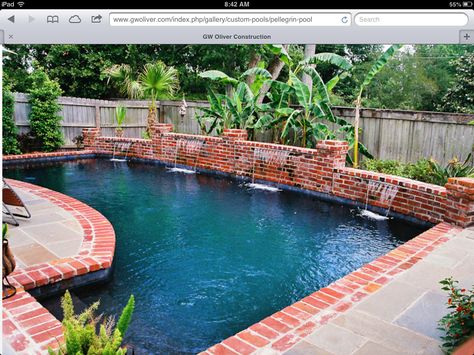 Waterfall from brick wall Pools With Red Brick Coping, Pool With Brick Wall, Brick Water Feature Pool, Brick Pool Surround, Pool With Red Brick, Brick Pool, Lap Pool Designs, Pool Paradise, Pool Surrounds