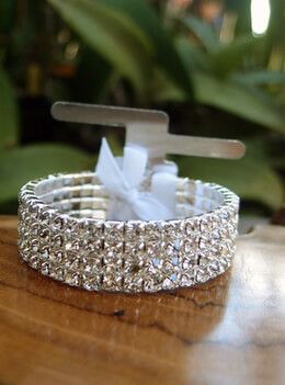 7.99 SALE PRICE! Adorn your wrist with this elegant elastic silver corsage bracelet with rhinestones. The bracelet is 1/2in wide with four rows of clear rhin... Silver Corsage, Bracelet Corsage, Bouquet Succulent, Corsage Bracelet, Corsage And Boutonniere, Branch Ring, Prom Flowers, Corsage Wedding, Wrist Corsage